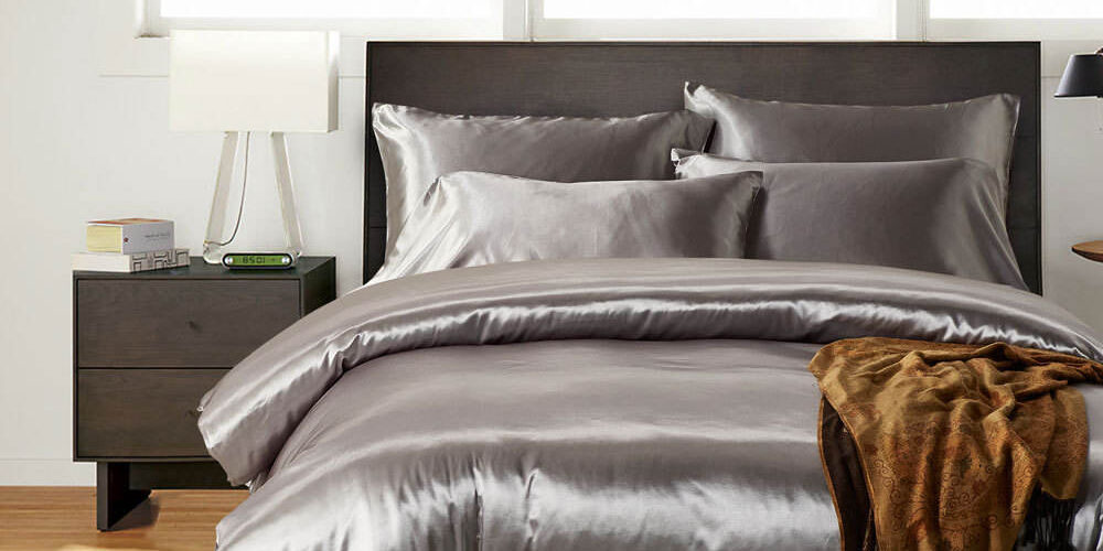 Luxury oversized silk hotel bedding set with smooth elegant drape