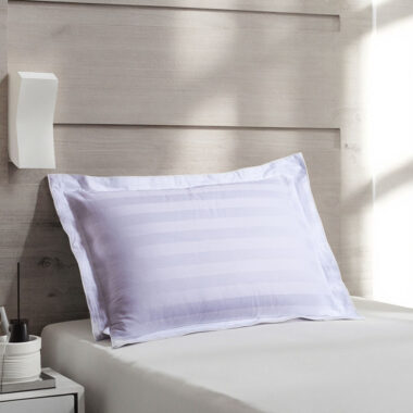 Soft white hotel pillow and pillowcase set for hospitality rooms