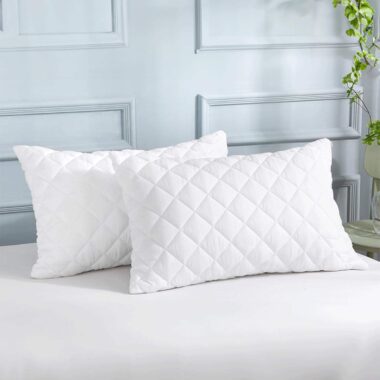 Soft white hotel pillow and pillowcase for hospitality rooms