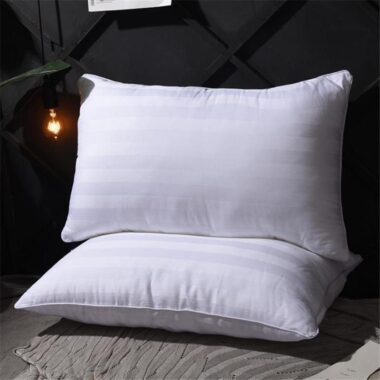 Soft white hotel pillow and pillowcase set for hospitality rooms