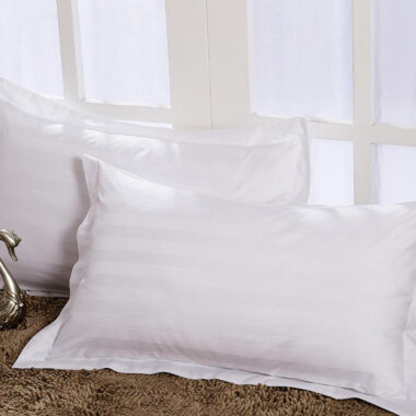 Soft white hotel pillow and pillowcase set for hospitality rooms