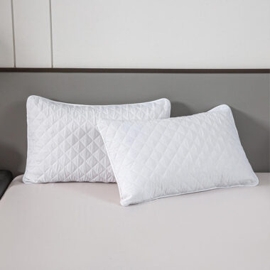 Soft white hotel pillow and pillowcase for hospitality rooms