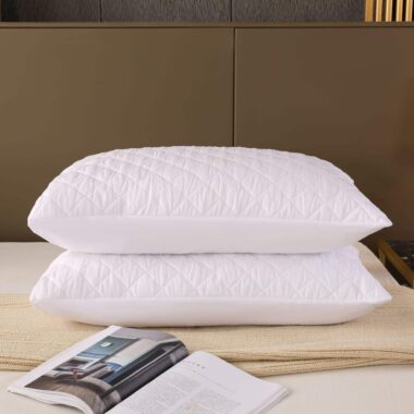 Soft white hotel pillow and pillowcase for hospitality rooms